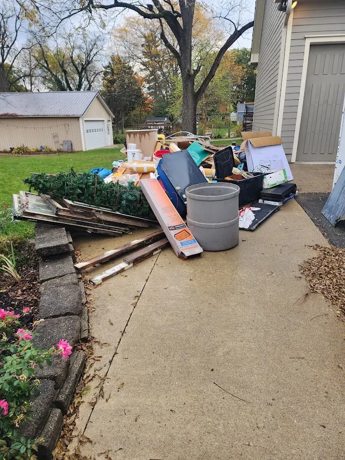 Dumpster being loaded with debris for Commercial Dumpster Rental in Hampshire